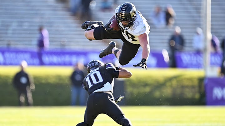 Nov 18, 2023; Evanston, Illinois, USA; Purdue Boilermakers tight end Garrett Miller (88) leaps over Nov 18, 2023; Evanston, Illinois, USA; Purdue Boilermakers tight end Garrett Miller (88) leaps over