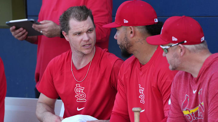 Feb 15, 2024; Jupiter, FL, USA;  St. Louis Cardinals starting pitcher Sonny Gray, left, talks with