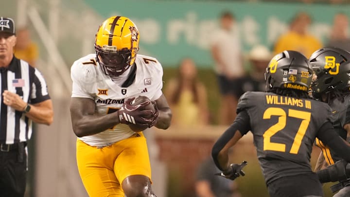 Sep 20, 2025; Waco, Texas, USA; Arizona State Sun Devils tight end Chamon Metayer (7) carries the ball against Baylor Bears cornerback Tevin Williams III (27) during the second half at McLane Stadium. Mandatory Credit: Chris Jones-Imagn Images Sep 20, 2025; Waco, Texas, USA; Arizona State Sun Devils tight end Chamon Metayer (7) carries the ball against Baylor Bears cornerback Tevin Williams III (27) during the second half at McLane Stadium. Mandatory Credit: Chris Jones-Imagn Images