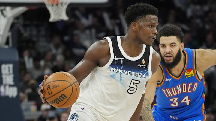 Feb 13, 2025; Minneapolis, Minnesota, USA; Minnesota Timberwolves guard Anthony Edwards (5) works past Oklahoma City Thunder guard Kenrich Williams (34) in the fourth quarter at Target Center. Mandatory Credit: Bruce Kluckhohn-Imagn Images