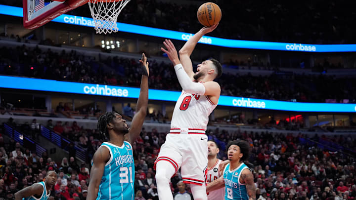 Jan 5, 2024; Chicago, Illinois, USA; Chicago Bulls guard Zach LaVine (8) shoots a layup as Charlotte Hornets forward JT Thor (21) defends during the second half at United Center. Mandatory Credit: David Banks-Imagn Images