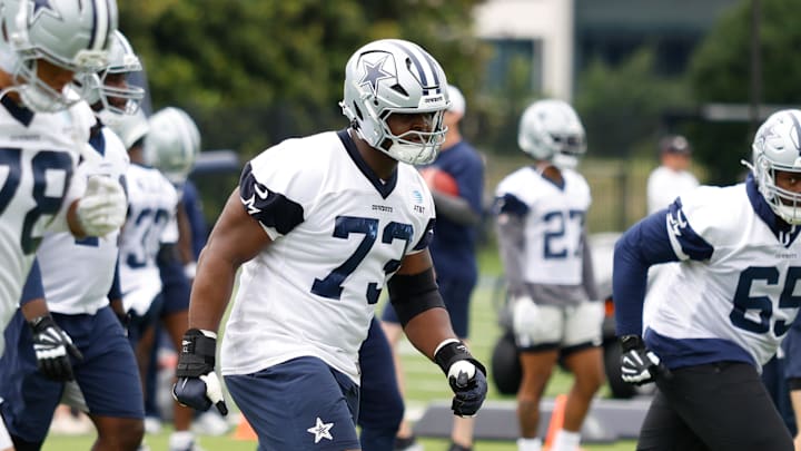 Dallas Cowboys guard Tyler Smith goes through a drill during practice.