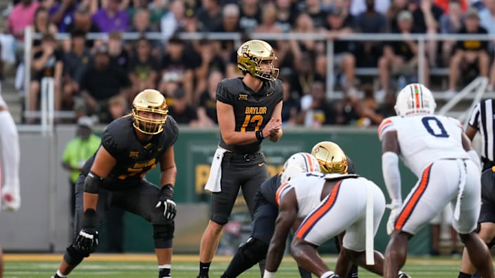 Aug 29, 2025; Waco, Texas, USA;  Baylor Bears quarterback Sawyer Robertson (13) in action against the Auburn Tigers during the first half at McLane Stadium. Mandatory Credit: Chris Jones-Imagn Images