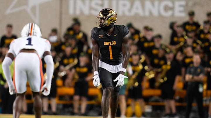 Aug 29, 2025; Waco, Texas, USA;  Baylor Bears tight end Michael Trigg (1) in action against Auburn Tigers safety Champ Anthony (1) during the first half at McLane Stadium. Mandatory Credit: Chris Jones-Imagn Images