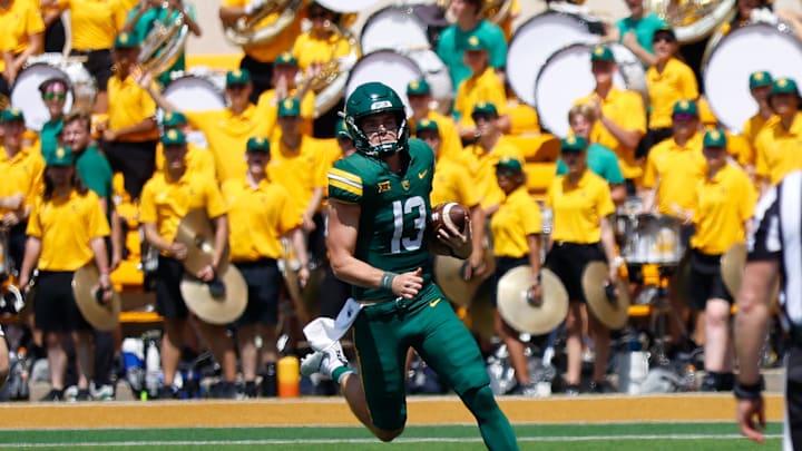 Sep 13, 2025; Waco, Texas, USA;  Baylor Bears quarterback Sawyer Robertson (13) carries the ball for a first down against the Samford Bulldogs during the second half at McLane Stadium. Mandatory Credit: Chris Jones-Imagn Images