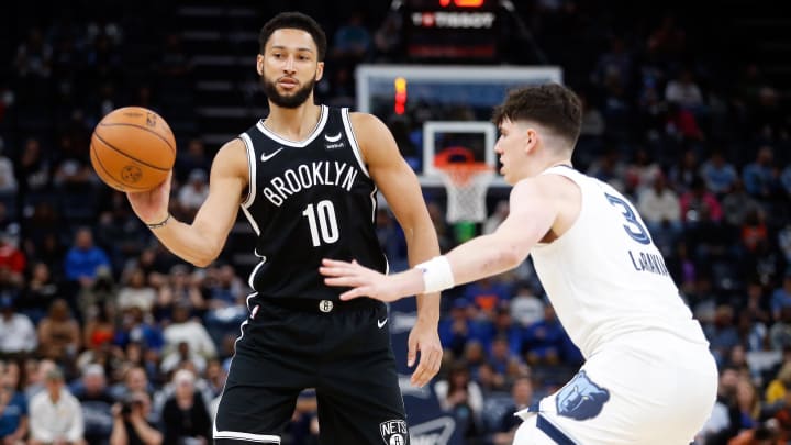 Feb 26, 2024; Memphis, Tennessee, USA; Brooklyn Nets guard Ben Simmons (10) passes the ball as Memphis Grizzlies forward Jake LaRavia (3) defends during the second half at FedExForum. Mandatory Credit: Petre Thomas-USA TODAY Sports