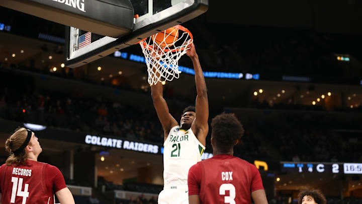 Mar 22, 2024; Memphis, TN, USA; Baylor Bears center Yves Missi (21) dunks the ball against the Colgate Raiders during the first half of the NCAA Tournament First Round at FedExForum. Mandatory Credit: Petre Thomas-USA TODAY Sports