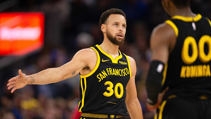 Jan 5, 2024; San Francisco, California, USA; Golden State Warriors guard Stephen Curry (30) gets a handshake from teammate Jonathan Kuminga (00) during the second quarter at Chase Center. Mandatory Credit: D. Ross Cameron-Imagn Images Jan 5, 2024; San Francisco, California, USA; Golden State Warriors guard Stephen Curry (30) gets a handshake from teammate Jonathan Kuminga (00) during the second quarter at Chase Center. Mandatory Credit: D. Ross Cameron-Imagn Images