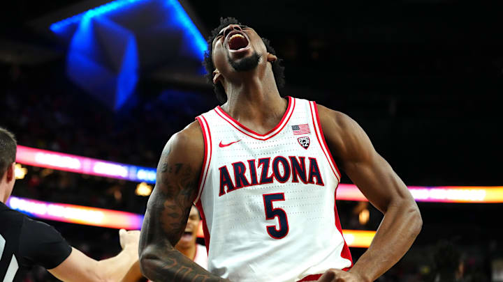 Mar 14, 2024; Las Vegas, NV, USA; Arizona Wildcats guard KJ Lewis (5) celebrates after making a play against the Southern California Trojans during the second half at T-Mobile Arena. Mandatory Credit: Stephen R. Sylvanie-Imagn Images