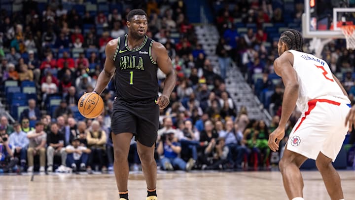 Jan 5, 2024; New Orleans, Louisiana, USA;  New Orleans Pelicans forward Zion Williamson (1) brings the ball up court against LA Clippers forward Kawhi Leonard (2) during the first half at Smoothie King Center. Mandatory Credit: Stephen Lew-Imagn Images