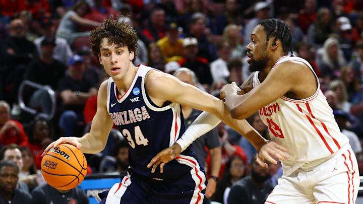 Mar 22, 2025; Wichita, KS, USA; Gonzaga Bulldogs forward Braden Huff (34) drives to the basket againstHouston Cougars forward J'Wan Roberts (13) during the first half at Intrust Bank Arena. Mandatory Credit: Nick Tre. Smith-Imagn Images