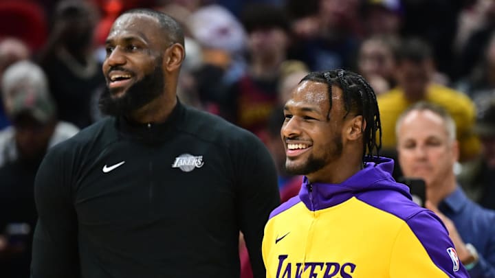 Los Angeles Lakers forward LeBron James and guard Bronny James warm up before a game.
