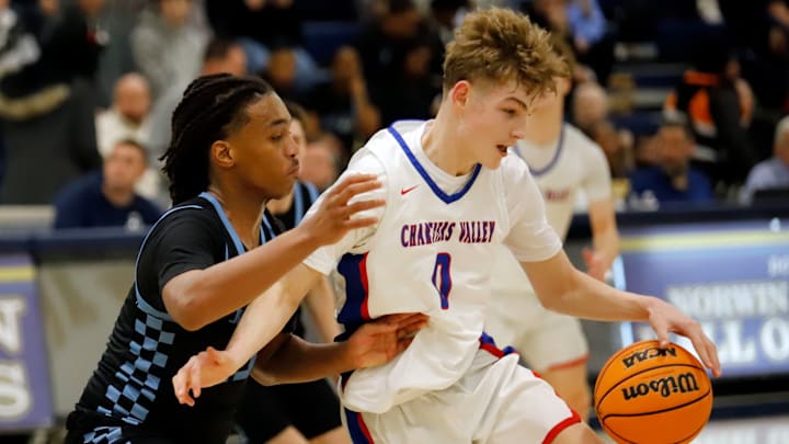 Chartiers Valley's Luca Federico, who finished with 13 points, attempts to get by Greater Johnstown's Amire Robinson Friday night during a PIAA Class 5A quarterfinal at Norwin High School.