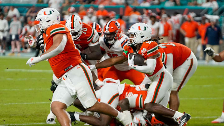 Nov 8, 2025; Miami Gardens, Florida, USA; Miami Hurricanes wide receiver Malachi Toney (10) rushes the ball against the Syracuse Orange during the third quarter at Hard Rock Stadium. Mandatory Credit: Jeff Romance-Imagn Images
