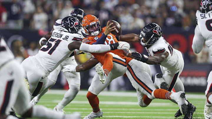 Sep 15, 2024; Houston, Texas, USA; Houston Texans defensive end Will Anderson Jr. (51) and defensive end Danielle Hunter (55) attempt to sack Chicago Bears quarterback Caleb Williams (18) during the first quarter at NRG Stadium.