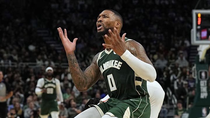 Oct 26, 2023; Milwaukee, Wisconsin, USA; Milwaukee Bucks guard Damian Lillard (0) reacts after being called for a foul during the third quarter against the Philadelphia 76ers at Fiserv Forum. Mandatory Credit: Jeff Hanisch-Imagn Images Oct 26, 2023; Milwaukee, Wisconsin, USA; Milwaukee Bucks guard Damian Lillard (0) reacts after being called for a foul during the third quarter against the Philadelphia 76ers at Fiserv Forum. Mandatory Credit: Jeff Hanisch-Imagn Images