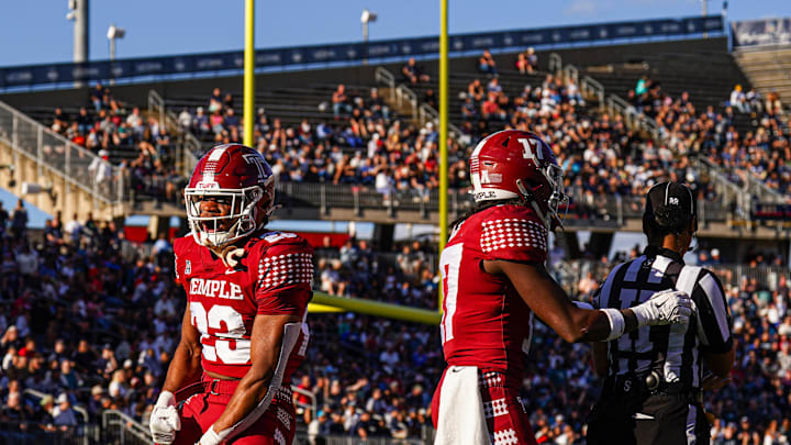 Oct 5, 2024; East Hartford, Connecticut, USA; Temple Owls linebacker Antwone Santiago (23) blocks the punt and linebacker Tyler Lepolo (17) recovers for a touchdown against the Connecticut Huskies in the second quarter at Rentschler Field at Pratt & Whitney Stadium. Mandatory Credit: David Butler II-Imagn Images