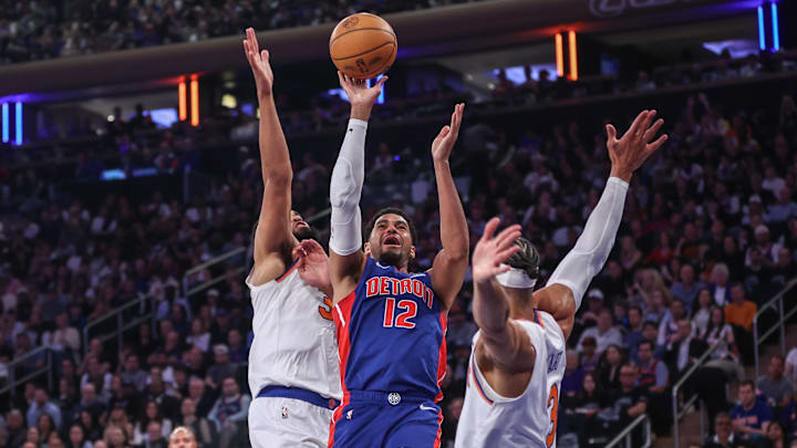 Apr 19, 2025; New York, New York, USA; Detroit Pistons forward Tobias Harris (12) looks to drive past New York Knicks center Karl-Anthony Towns (32) and guard Josh Hart (3) in Game One of the First Round of the NBA Playoffs at Madison Square Garden. Mandatory Credit: Wendell Cruz-Imagn Images