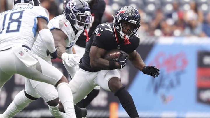 Sep 28, 2025; Houston, Texas, USA; Houston Texans running back Woody Marks (27) runs with the ball during the third quarter against the Tennessee Titans at NRG Stadium. Mandatory Credit: Troy Taormina-Imagn Images Sep 28, 2025; Houston, Texas, USA; Houston Texans running back Woody Marks (27) runs with the ball during the third quarter against the Tennessee Titans at NRG Stadium. Mandatory Credit: Troy Taormina-Imagn Images