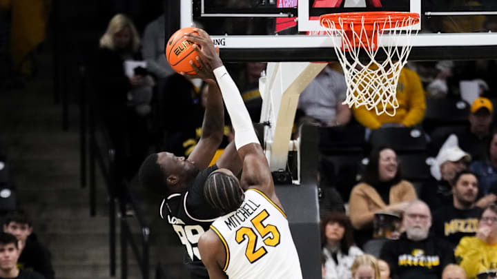 Jan 31, 2026; Columbia, Missouri, USA; Missouri Tigers guard Mark Mitchell (25) blocks the shot of Mississippi State Bulldogs forward Achor Achor (99) during the first half of the game at Mizzou Arena. Mandatory Credit: Denny Medley-Imagn Images Jan 31, 2026; Columbia, Missouri, USA; Missouri Tigers guard Mark Mitchell (25) blocks the shot of Mississippi State Bulldogs forward Achor Achor (99) during the first half of the game at Mizzou Arena. Mandatory Credit: Denny Medley-Imagn Images