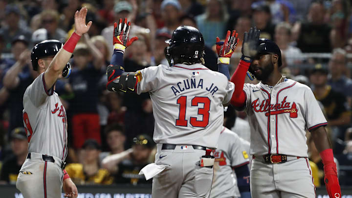 May 24, 2024; Pittsburgh, Pennsylvania, USA;  Atlanta Braves third baseman Zack Short (left) and Atlanta center fielder Michael Harris II (right) congratulate right fielder  Ronald Acuna Jr. (13) crossing home plate on a three-run home run against the Pittsburgh Pirates during the eighth inning at PNC Park. Mandatory Credit: Charles LeClaire-Imagn Images