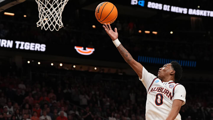 Mar 30, 2025; Atlanta, GA, USA; Auburn Tigers guard Tahaad Pettiford (0) drives during the second half in the South Regional final of the 2025 NCAA tournament against the Michigan State Spartans at State Farm Arena. Mandatory Credit: Dale Zanine-Imagn Images