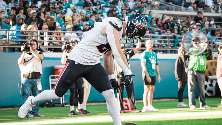 Dec 1, 2024; Jacksonville, Florida, USA; Houston Texans tight end Dalton Schultz (86) celebrates a touchdown against the Jacksonville Jaguars in the fourth quarter at EverBank Stadium. Mandatory Credit: Jeremy Reper-Imagn Images
