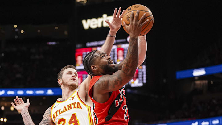Toronto Raptors guard Jamal Shead takes the ball to the basket past Atlanta Hawks guard Garrison Mathews. Toronto Raptors guard Jamal Shead takes the ball to the basket past Atlanta Hawks guard Garrison Mathews.