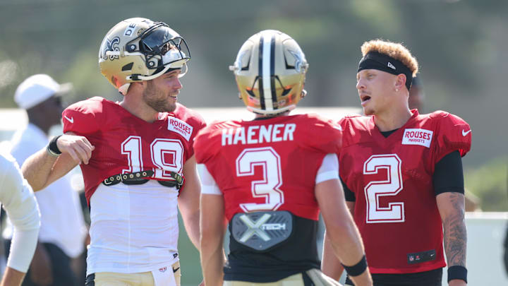 Jul 28, 2025; Metairie, LA, USA; New Orleans Saints quarterback Hunter Dekkers (18) and quarterback Spencer Rattler (2) and quarterback Jake Haener (3)at Ochsner Sports Performance Center. Mandatory Credit: Stephen Lew-Imagn Images Jul 28, 2025; Metairie, LA, USA; New Orleans Saints quarterback Hunter Dekkers (18) and quarterback Spencer Rattler (2) and quarterback Jake Haener (3)at Ochsner Sports Performance Center. Mandatory Credit: Stephen Lew-Imagn Images
