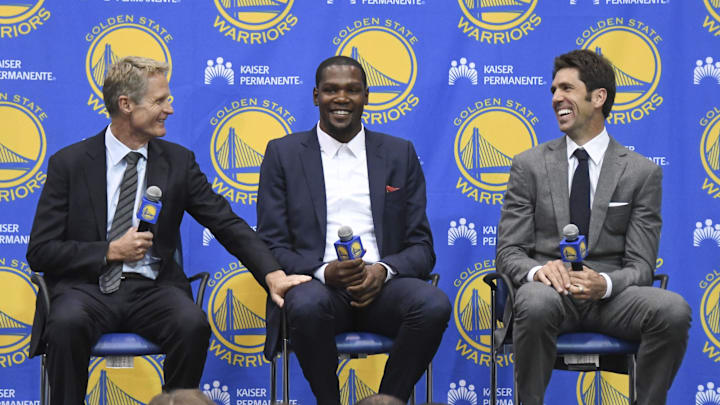 Golden State Warriors head coach Steve Kerr (left), Kevin Durant (center), and general manager Bob Myers.