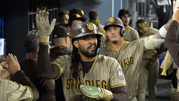 Sep 23, 2026; Los Angeles, California, USA; San Diego Padres right fielder Fernando Tatis Jr. (23) is greeted in the dugout after scoring in the fifth inning against the Los Angeles Dodgers at Dodger Stadium. Mandatory Credit: Jayne Kamin-Oncea-Imagn Images Sep 23, 2026; Los Angeles, California, USA; San Diego Padres right fielder Fernando Tatis Jr. (23) is greeted in the dugout after scoring in the fifth inning against the Los Angeles Dodgers at Dodger Stadium. Mandatory Credit: Jayne Kamin-Oncea-Imagn Images
