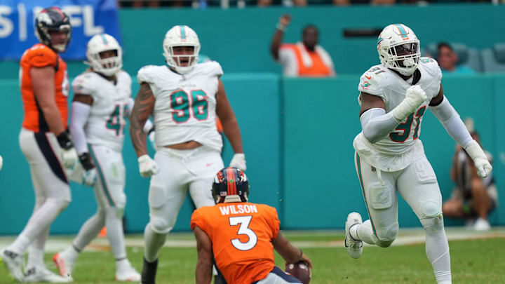 Miami Dolphins defensive end Emmanuel Ogbah (91) celebrates a sack Denver Broncos quarterback