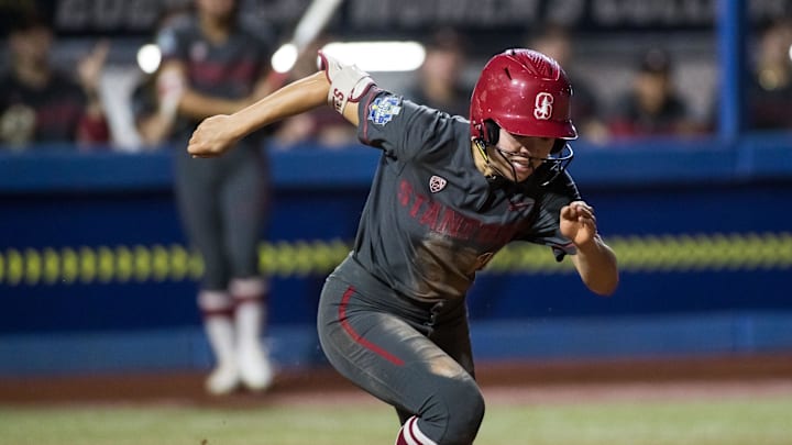 Jun 2, 2024; Oklahoma City, OK, USA; Stanford Cardinals infielder Emily Jones (18) runs to first fin the fifth inning against the UCLA Bruins during a Women's College World Series softball losers bracket elimination game at Devon Park. Mandatory Credit: Brett Rojo-Imagn Images