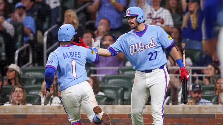 Apr 25, 2026; Atlanta, Georgia, USA; Atlanta Braves second baseman Ozzie Albies (1) celebrates with third baseman Austin Riley (27) after scoring a run against the Philadelphia Phillies in the sixth inning at Truist Park. Mandatory Credit: Brett Davis-Imagn Images
