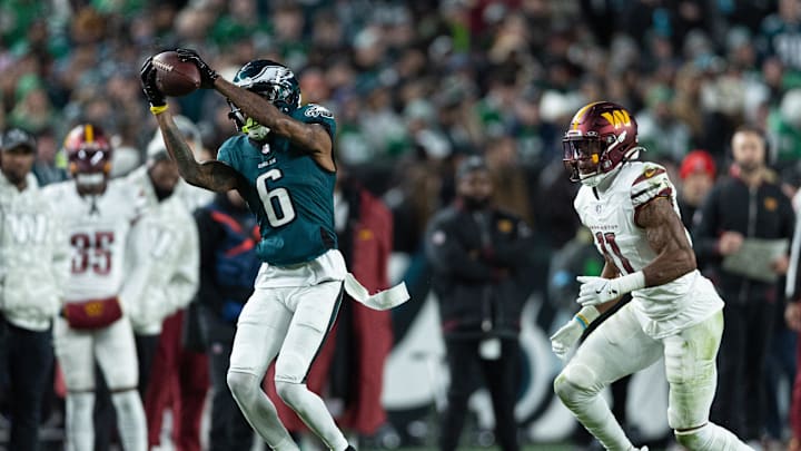 Nov 14, 2024; Philadelphia, Pennsylvania, USA; Philadelphia Eagles wide receiver DeVonta Smith (6) makes a catch in front of Washington Commanders safety Jeremy Chinn (11) during the second quarter at Lincoln Financial Field. Mandatory Credit: Bill Streicher-Imagn Images