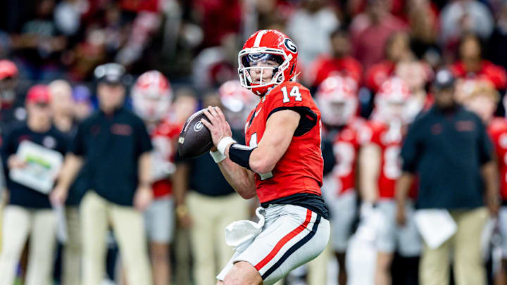 Jan 2, 2025; New Orleans, LA, USA;  Georgia Bulldogs quarterback Gunner Stockton (14) drops back to pass against against the Notre Dame Fighting Irish during the second half at Caesars Superdome. Mandatory Credit: Stephen Lew-Imagn Images