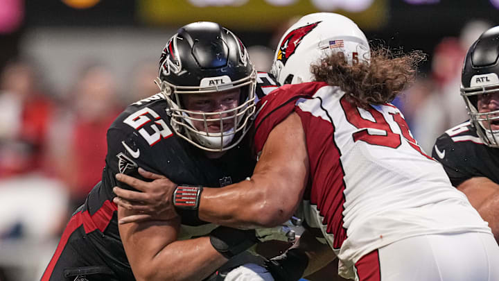 Jan 1, 2023; Atlanta, Georgia, USA; Atlanta Falcons guard Chris Lindstrom (63) blocks Arizona Cardinals defensive tackle Leki Fotu (95) during the second half at Mercedes-Benz Stadium.