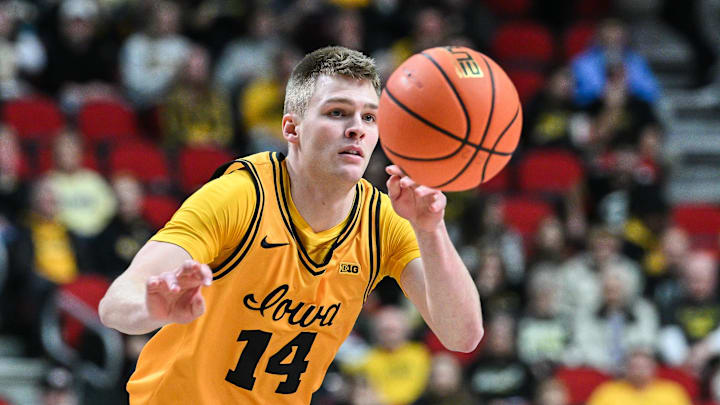 Dec 20, 2025; Iowa City, Iowa, USA; Iowa Hawkeyes guard Bennett Stirtz (14) controls the ball against the Bucknell Bison during the first half at Casey’s Center.