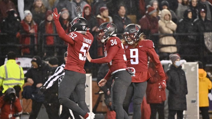 Nov 19, 2021; Pullman, Washington, USA; Washington State Cougars linebacker Kyle Thornton (52) celebrates against the Arizona Wildcats in the first half at Gesa Field at Martin Stadium. Mandatory Credit: James Snook-USA TODAY Sports Nov 19, 2021; Pullman, Washington, USA; Washington State Cougars linebacker Kyle Thornton (52) celebrates against the Arizona Wildcats in the first half at Gesa Field at Martin Stadium. Mandatory Credit: James Snook-USA TODAY Sports