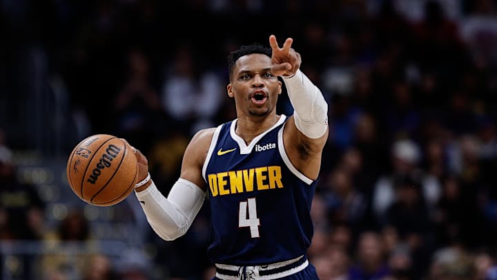 Apr 2, 2025; Denver, Colorado, USA; Denver Nuggets guard Russell Westbrook (4) gestures as he dribbles the ball up court in the third quarter against the San Antonio Spurs at Ball Arena. Mandatory Credit: Isaiah J. Downing-Imagn Images