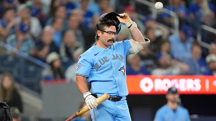 Jun 24, 2026; Toronto, Ontario, CAN; Toronto Blue Jays left fielder Davis Schneider (36) adjusts his helemt after taking a strike against the Houston Astros during the seventh inning at Rogers Centre. Mandatory Credit: John E. Sokolowski-Imagn Images
