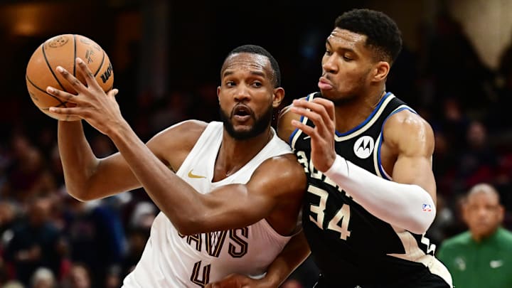 Dec 20, 2024; Cleveland, Ohio, USA; Cleveland Cavaliers forward Evan Mobley (4) drives to the basket against Milwaukee Bucks forward Giannis Antetokounmpo (34) during the second half at Rocket Mortgage FieldHouse. Mandatory Credit: Ken Blaze-Imagn Images