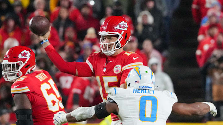 Dec 8, 2024; Kansas City, Missouri, USA; Kansas City Chiefs quarterback Patrick Mahomes (15) throws a pass as Los Angeles Chargers linebacker Daiyan Henley (0) attempts the sack during the second half at GEHA Field at Arrowhead Stadium. Mandatory Credit: Denny Medley-Imagn Images Dec 8, 2024; Kansas City, Missouri, USA; Kansas City Chiefs quarterback Patrick Mahomes (15) throws a pass as Los Angeles Chargers linebacker Daiyan Henley (0) attempts the sack during the second half at GEHA Field at Arrowhead Stadium. Mandatory Credit: Denny Medley-Imagn Images