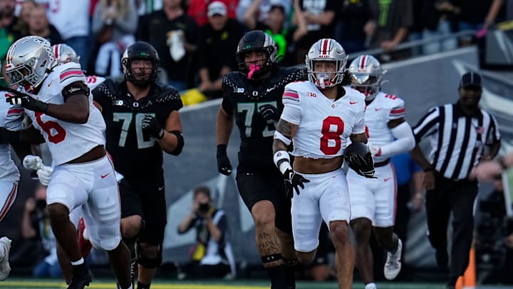 Oct 12, 2024; Eugene, Oregon, USA; Ohio State Buckeyes safety Lathan Ransom (8) runs back an interception during the first half of the NCAA football game against the Oregon Ducks at Autzen Stadium