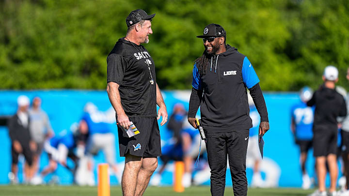 Detroit Lions head coach Dan Campbell talks to defensive coordinator Kelvin Sheppard at practice during training camp at Meijer Performance Center in Allen Park on Tuesday, July 22, 2025.
