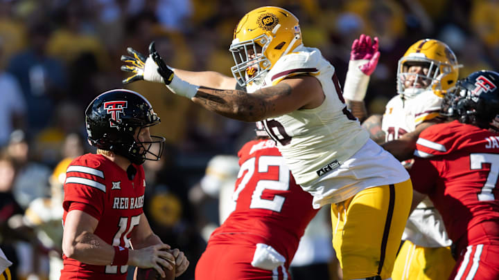 Oct 18, 2025; Tempe, Arizona, USA; Arizona State Sun Devils defensive lineman Anthonie Cooper (96) sacks Texas Tech Red Raiders quarterback Will Hammond (15) in the second half at Mountain America Stadium. Mandatory Credit: Mark J. Rebilas-Imagn Images Oct 18, 2025; Tempe, Arizona, USA; Arizona State Sun Devils defensive lineman Anthonie Cooper (96) sacks Texas Tech Red Raiders quarterback Will Hammond (15) in the second half at Mountain America Stadium. Mandatory Credit: Mark J. Rebilas-Imagn Images