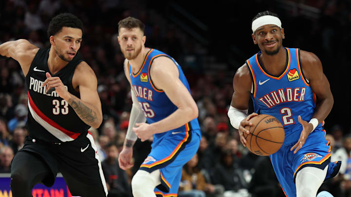 Nov 5, 2025; Portland, Oregon, USA;  Oklahoma City Thunder guard Shai Gilgeous-Alexander (2) dribbles the ball past Portland Trail Blazers forward Toumani Camara (33) as teammate Thunder’s center/forward Isaiah Hartenstein (55) watches during the first half at Moda Center. Mandatory Credit: Jaime Valdez-Imagn Images

