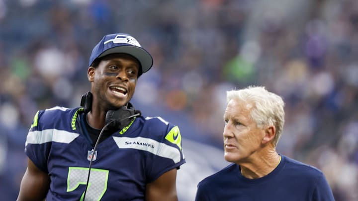 Aug 19, 2023; Seattle, Washington, USA; Seattle Seahawks quarterback Geno Smith (7) talks with head coach Pete Carroll during the second quarter against the Dallas Cowboys at Lumen Field. Mandatory Credit: Joe Nicholson-Imagn Images