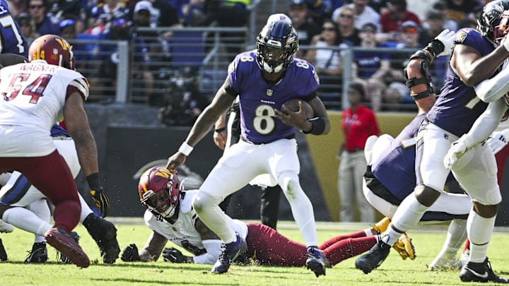 Oct 13, 2024; Baltimore, Maryland, USA;  Baltimore Ravens quarterback Lamar Jackson (8) rushes during the second half against the Washington Commanders at M&T Bank Stadium. Mandatory Credit: Tommy Gilligan-Imagn Images