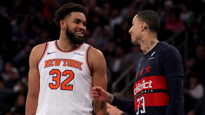 Nov 18, 2024; New York, New York, USA; Washington Wizards forward Kyle Kuzma (33) talks to New York Knicks center Karl-Anthony Towns (32) during a foul shot during the third quarter at Madison Square Garden. Mandatory Credit: Brad Penner-Imagn Images